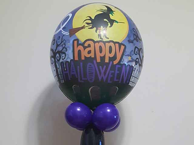 Halloween themed column with a Happy Halloween printed bubble balloon on the top