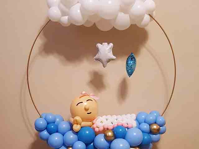 Sleeping baby balloon design with clouds on top and stars hanging down