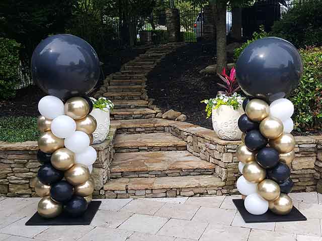 Two balloon columns using graduation colors