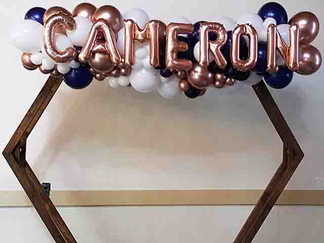 Organic Garland with name Cameron in letter balloons