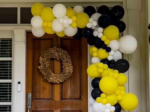 Organic Balloon Garland using yellow, white, and black balloons