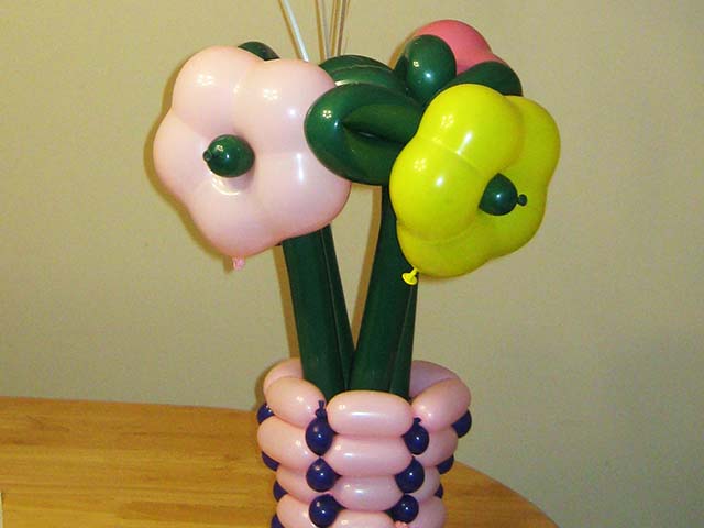 Balloon design of flowers and a flower vase with Happy Mother's Day Balloons